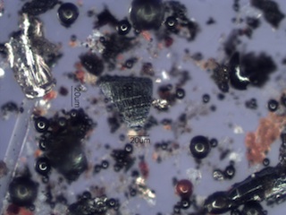 Mill Scale and Magnetite Spheres Under the Microscope