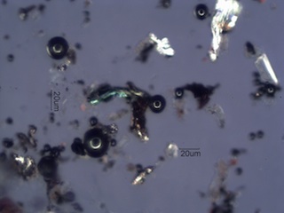 Mill Scale and Magnetite Spheres Under the Microscope